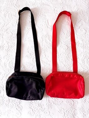 lot of two gently loved belt bags in black + red a new day everywhere